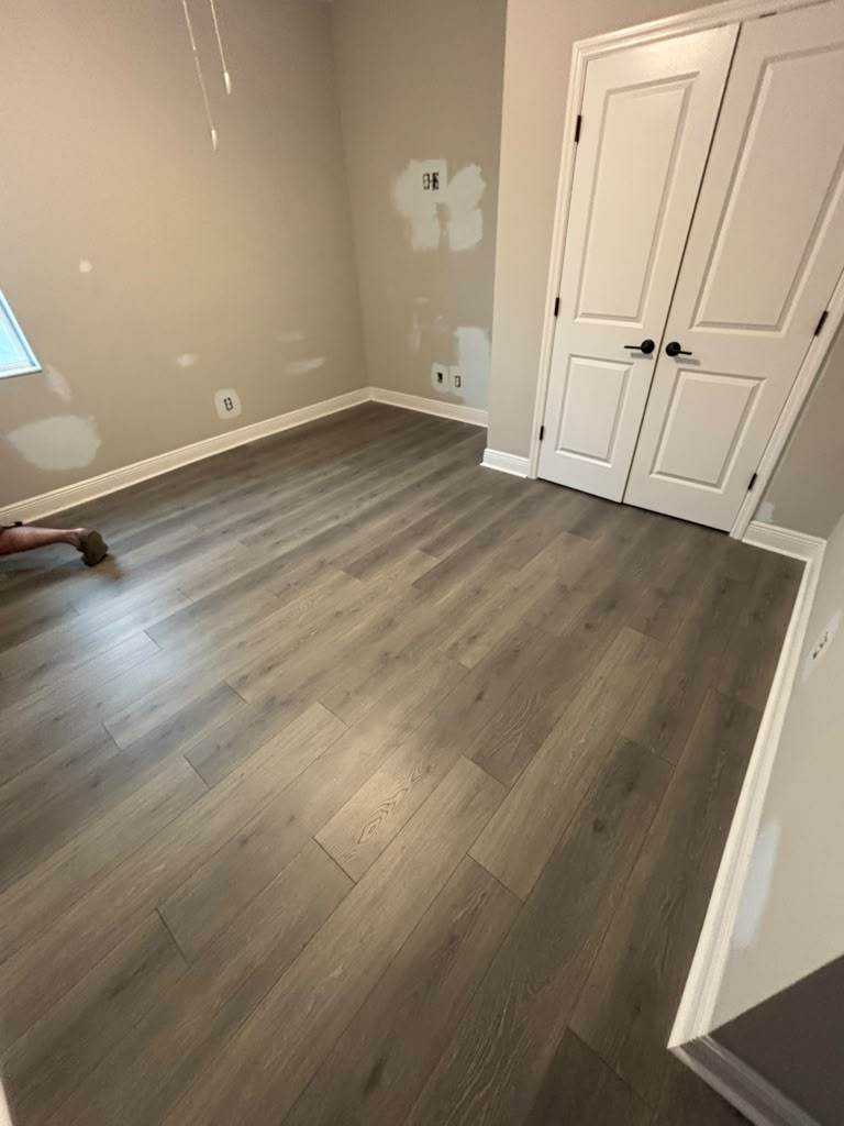 Baseboards and door frames around a closet